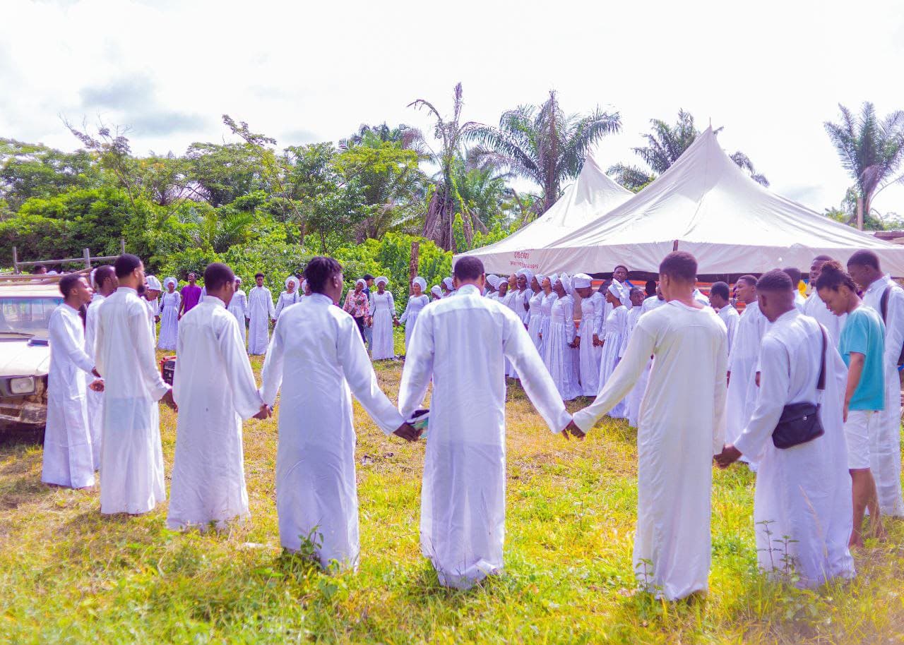 CCCFSP students joining hands in prayer